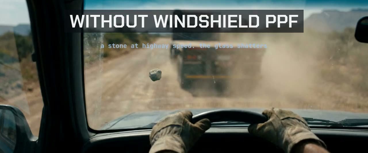 A highway stone striking a windshield protected by film